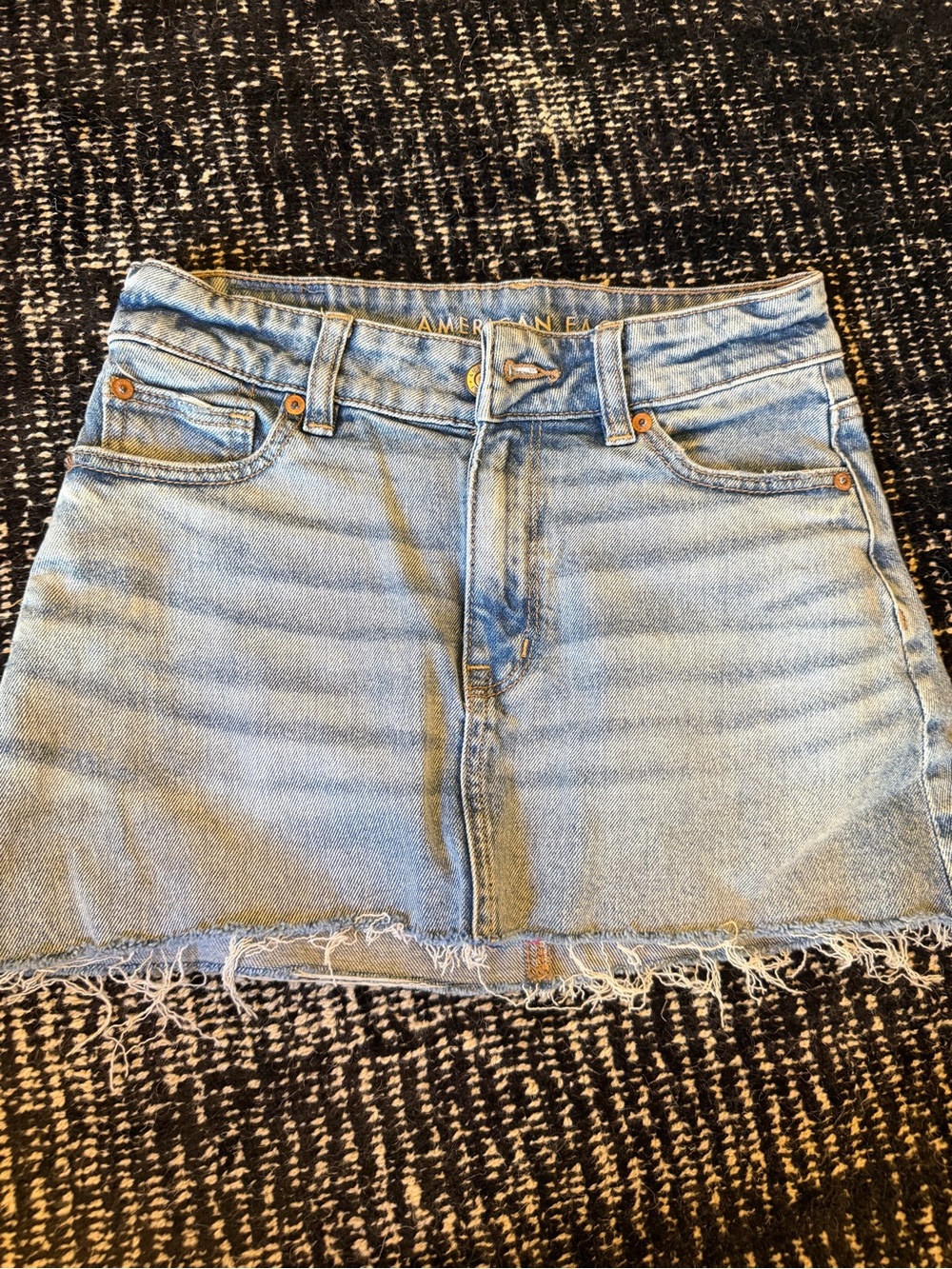 American Eagle Outfitters Light Wash Denim Mini Skirt with Frayed Hem